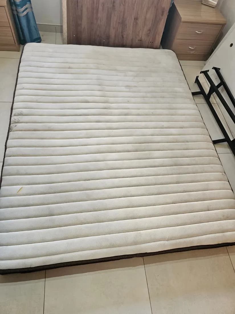 yellowed double mattress before cleaning by ARA Clean Malta