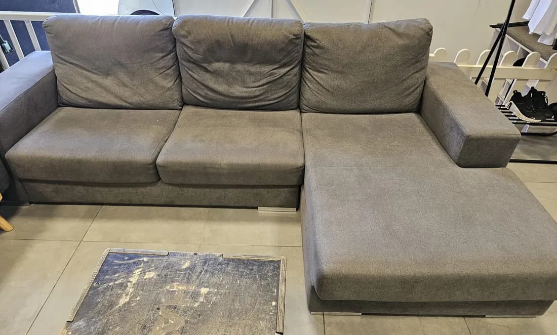 grey fabric chaise sofa before cleaning by ARA Clean Malta