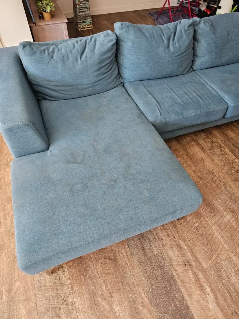 light blue fabric chaise sofa before cleaning by ARA Clean Malta